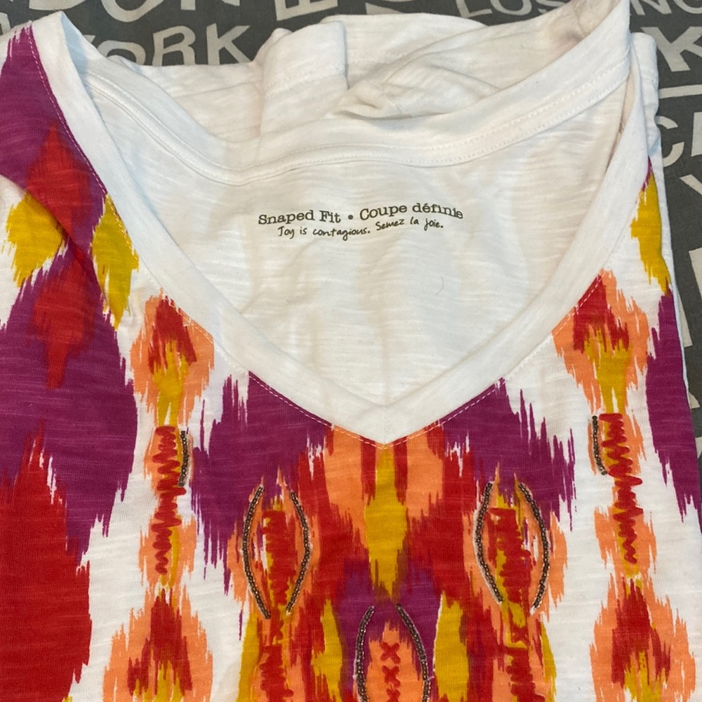 NWOT Woman’s white patterned t-shirt